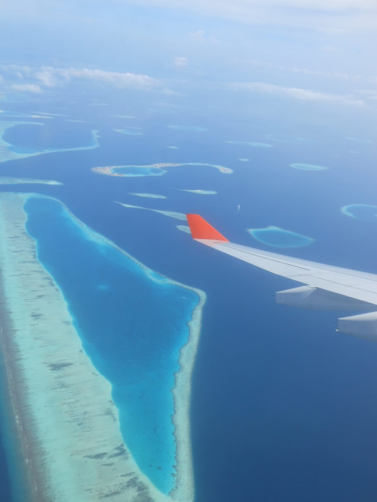 A-view-from-a-seaplane-on-Maldives-islands-and plane-wing