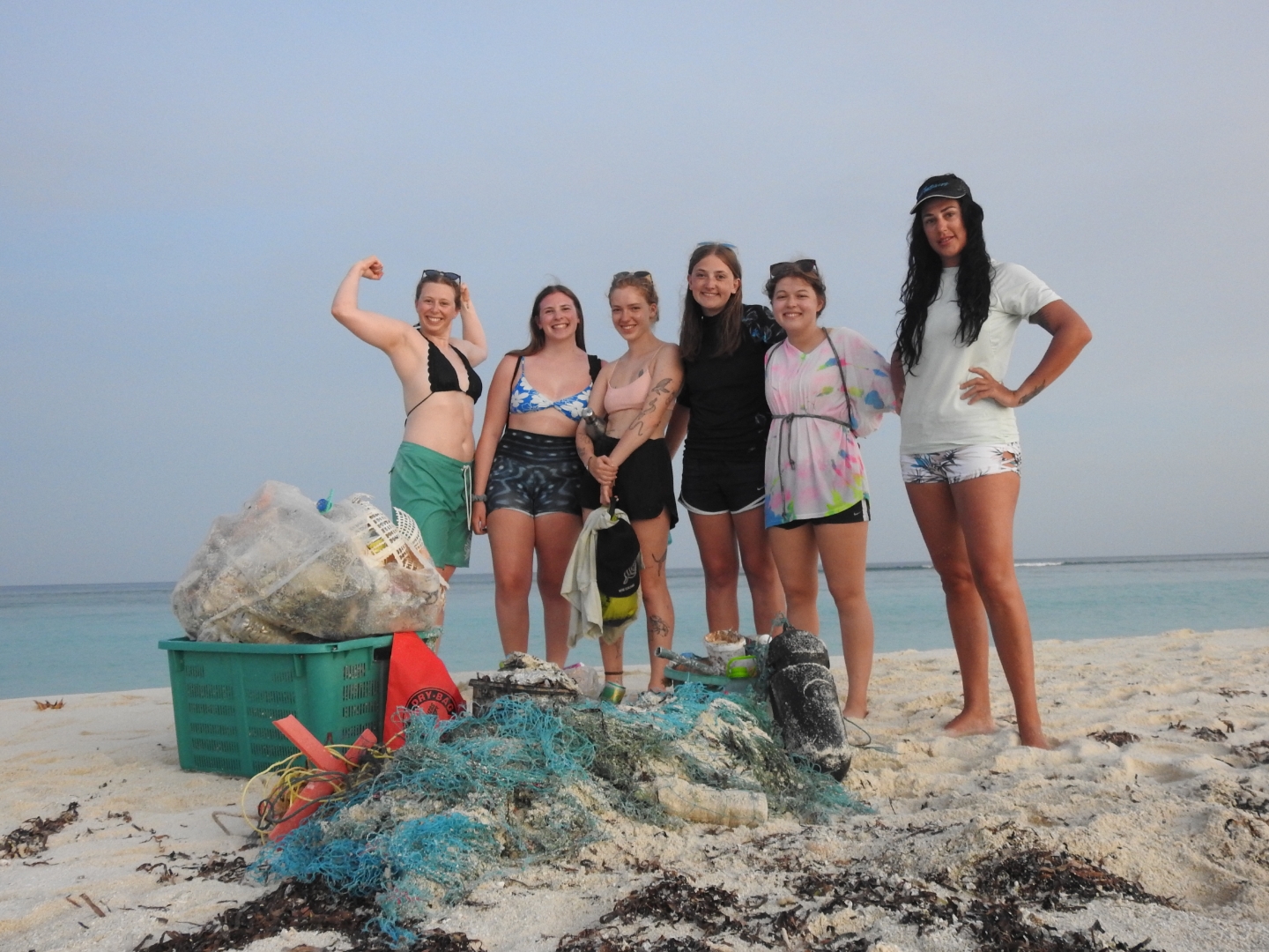 A-Group-of-Guests-with-the-trash-they-collected-after-a-beach-cleanup-in-a-Maldivian-Island