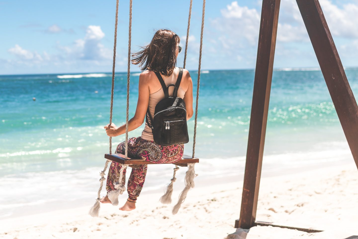 A-guest-on-a-swing-taking-in-the-view-from-the-beach-in-maldives