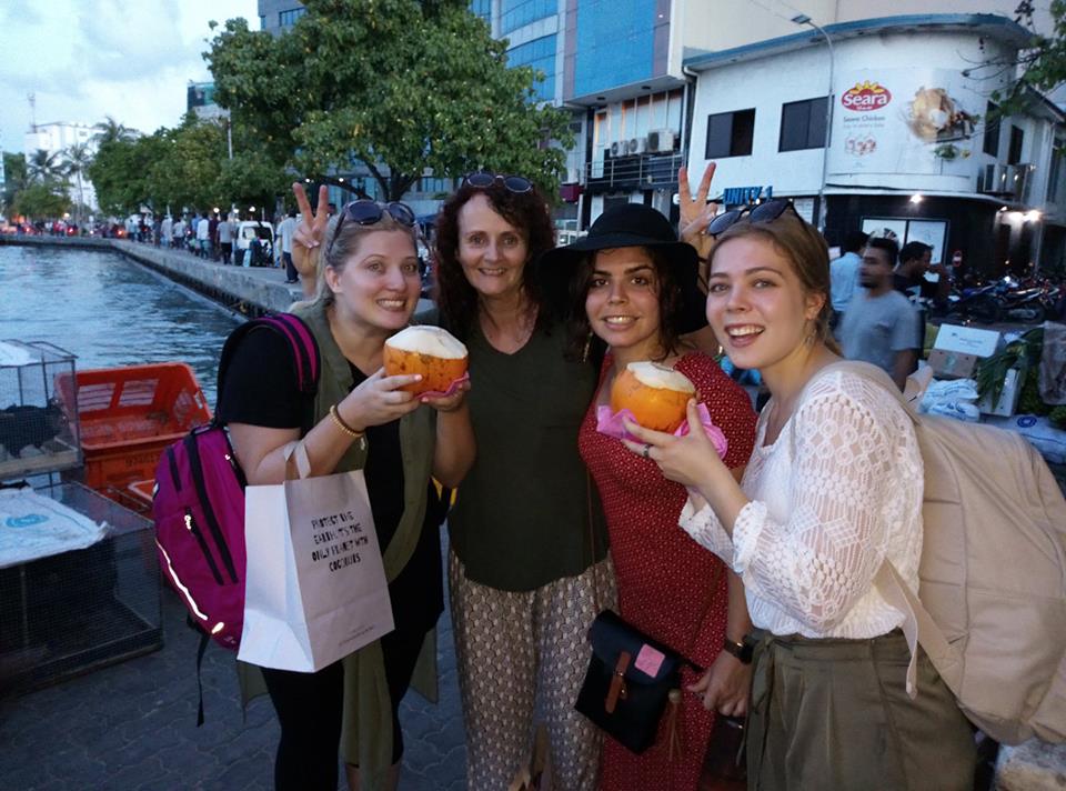 Leeann and her friends showing nostraw needed to enjoy a kurumba on yesterday's Male walking tour