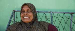 A woman from the Maldives smiles at the camera