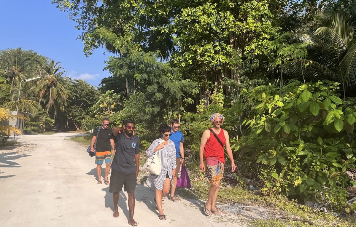 a gropr of tourists with a guide on a Goidhoo island